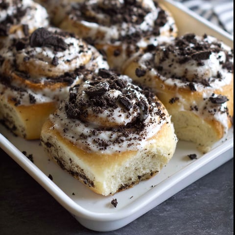 A plate of cookies and cream rolls.