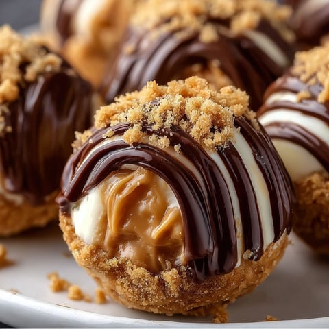 A plate of chocolate and peanut butter balls.