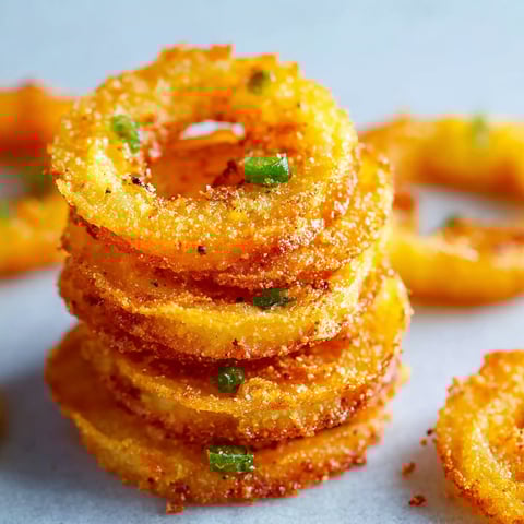 A stack of onion rings on a table.